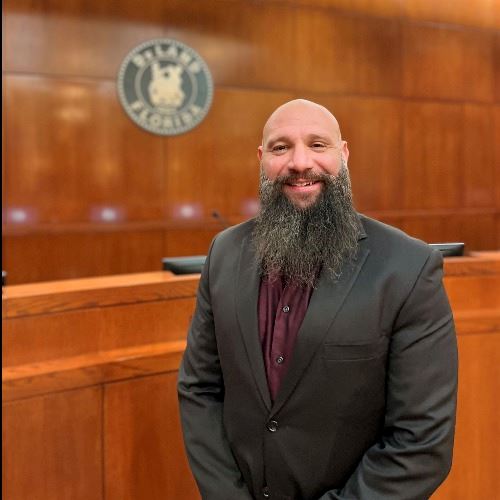 Commissioner Daniel Reed